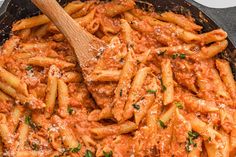 a skillet filled with pasta and sauce