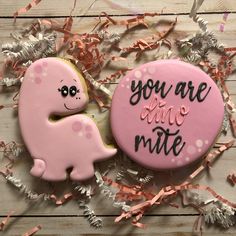 two decorated cookies that say you are one mite