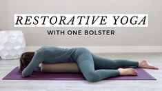 a woman is doing yoga on a mat with the words restorative yoga with one bolster