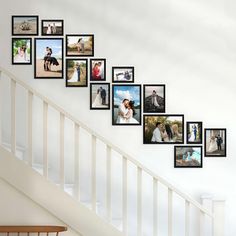 a staircase with many pictures hanging on the wall