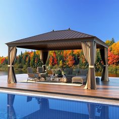 a gazebo sitting next to a swimming pool in the middle of fall season with chairs and tables around it