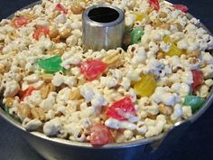 a metal bowl filled with lots of candy