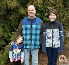 a man and two children standing next to each other