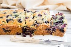 a loaf of blueberry bread cut into slices