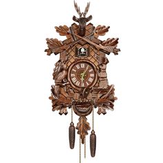 a wooden cuckoo clock hanging on the wall