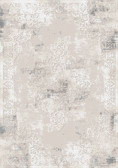 a beige and white rug with an ornate design on the bottom, in shades of gray