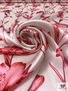 red and white fabric with flowers on it