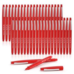 the red pen is lined up next to it's case and eight other pens