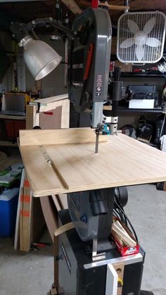 a workbench in a garage with tools on it