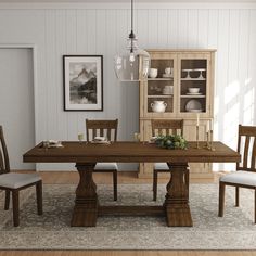 a dining room table with chairs and plates on it