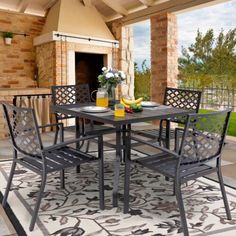 an outdoor dining table with four chairs