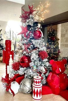 a christmas tree decorated with red and silver ornaments