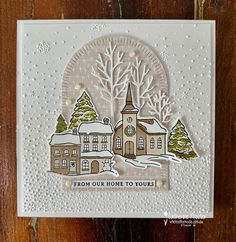 a card with a house and trees on it