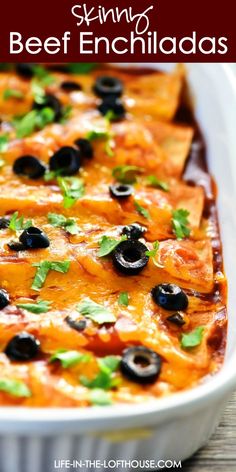 an enchilada dish with black olives and cilantro