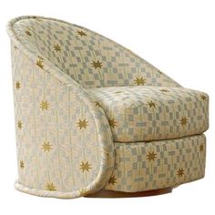 an upholstered swive chair with stars on the arm and backrests