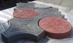 two circular shaped concretes sitting on top of a table