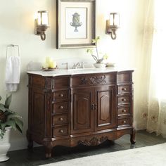 a bathroom vanity with two sinks and a mirror