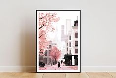 a poster hanging on the wall in front of a white wall with a pink tree