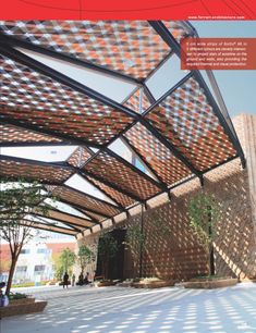 the cover of an architectural magazine shows a building with a pergolated roof and brick walls