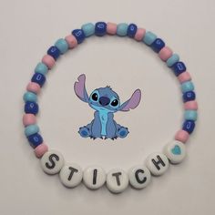 a beaded bracelet with the word stitch spelled out in front of an image of stitch