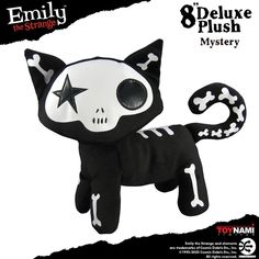 a black and white cat stuffed animal with stars on it's head, in the shape of a skull