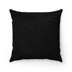 a black pillow on a white background