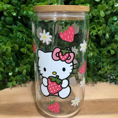 hello kitty strawberries and daisies on clear glass tumbler cup with strawberries