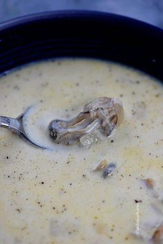 a bowl of soup with mushrooms and broth