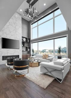 a modern living room with white furniture and large windows