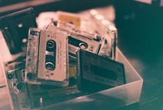 an old fashioned cassette player sitting on top of a table