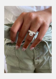 a woman's hand with a ring on her finger