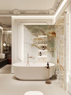 an elegant bathroom with marble walls and flooring, including a freestanding bathtub