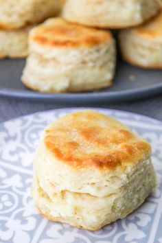 some biscuits are on a plate next to another one