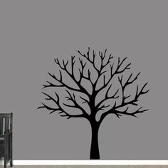 a tree with no leaves is shown in this nursery wall decal, it's black