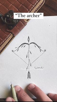 someone is drawing an arrow on paper with the words'the archer'above it