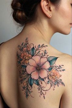 a woman with a flower tattoo on her back