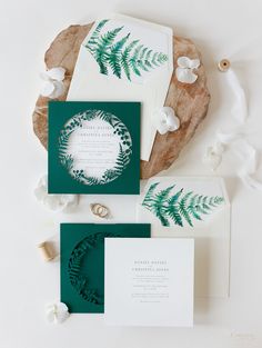 the wedding stationery was done in green and white, with an intricate fern design