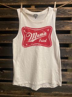 Country Deep Mama Tried Muscle tank top Country Deep Slub muscle tank   50% polyester/37.5% combed and ring-spun cotton/12.5% rayon Side-seamed Relaxed, drapey fit Low cut armhole Curved bottom hem Sizes: S-2XL Spring Letter Print Tank Top, Cotton Graphic Print Racerback Tank Top, Summer Cotton Muscle Tee For Workout, Summer Workout Cotton Muscle Tee, Stretch Cotton Muscle Tee, Casual Graphic Print Tank Top, Stretch Cotton Vest With Letter Print, Stretch Cotton Muscle Tee Tank, Cotton Graphic Print Tank Top