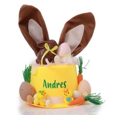 an easter cake with bunny ears and eggs in it's centerpiece that says, antaress