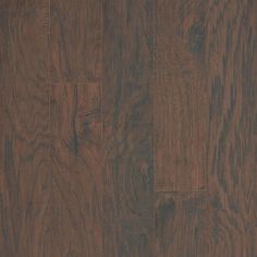 wood flooring that looks like it has been painted in dark brown and is very hard to