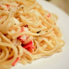 a close up view of some noodles on a plate