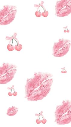 pink lipstick and cherries on a white background with the word, love is in the air