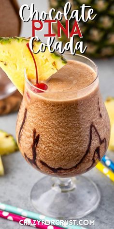 chocolate pina colada in a glass with a slice of pineapple on top