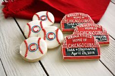 decorated cookies with chicago cubs names and baseballs on them are sitting next to a red scarf