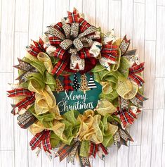 a christmas wreath hanging on the side of a wall