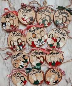 twelve personalized christmas ornament hanging on a marble table