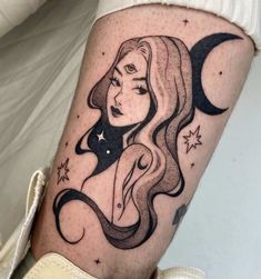 a woman with long hair and stars on her leg