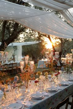 a table set up for an outdoor dinner party