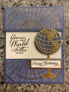 a happy birthday card with a globe on it