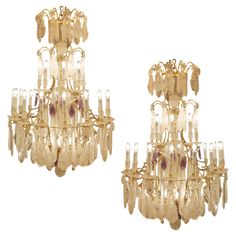 a pair of chandeliers with glass drops